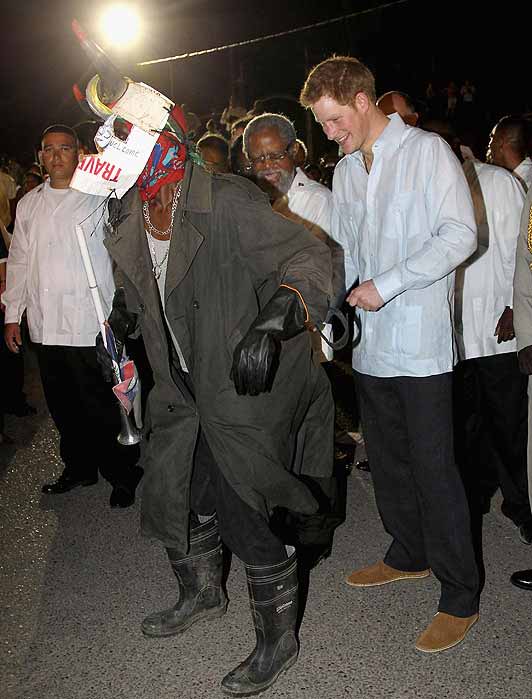 Prince Harry with masked dancer in Belize