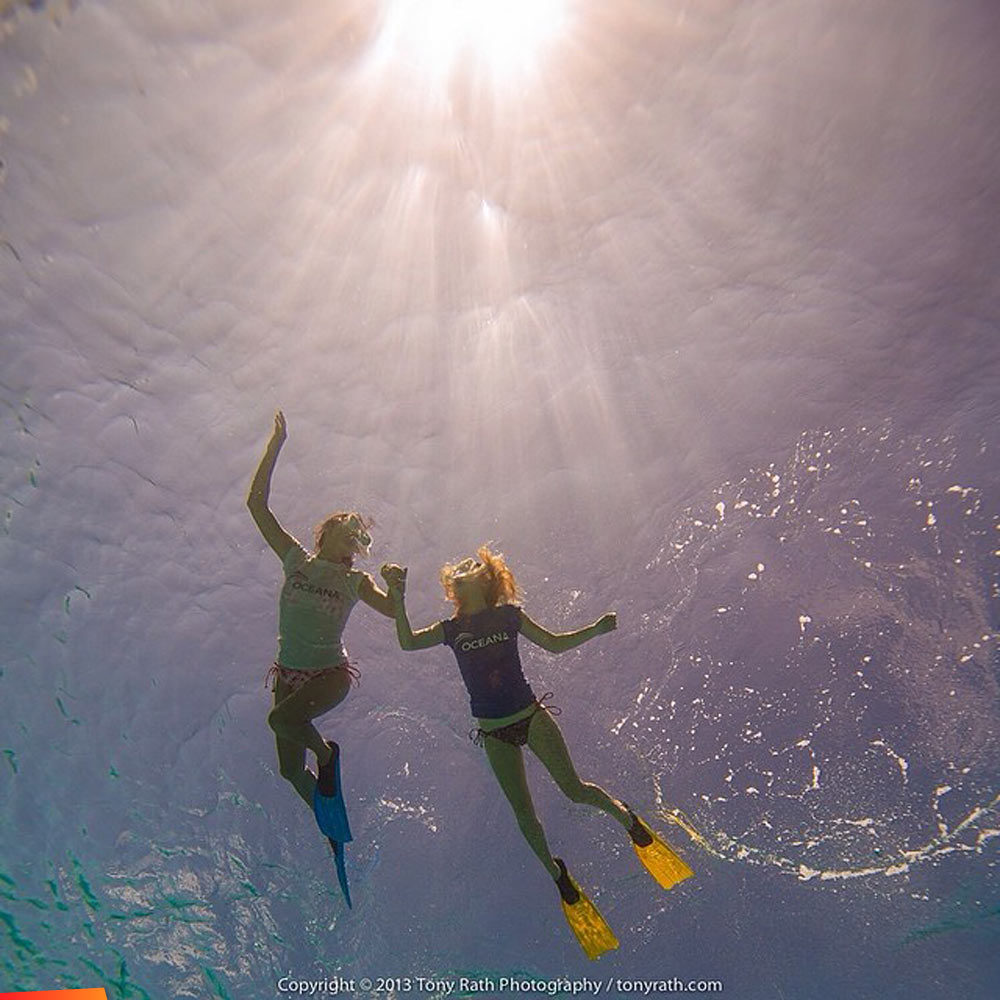 Rashida Jones and Angela Kinsey snorkeling above the coral reefs of Belize