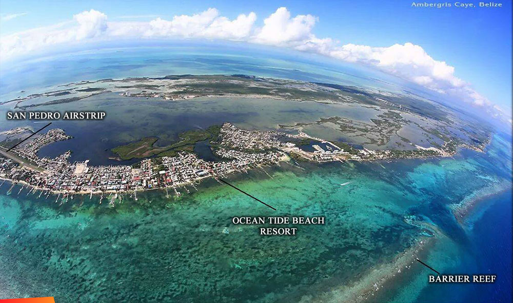 Aerial view from the east looking west of the center of Ambergris Caye and San Pedro, wide angle includes barrier reef and lagoons to the west