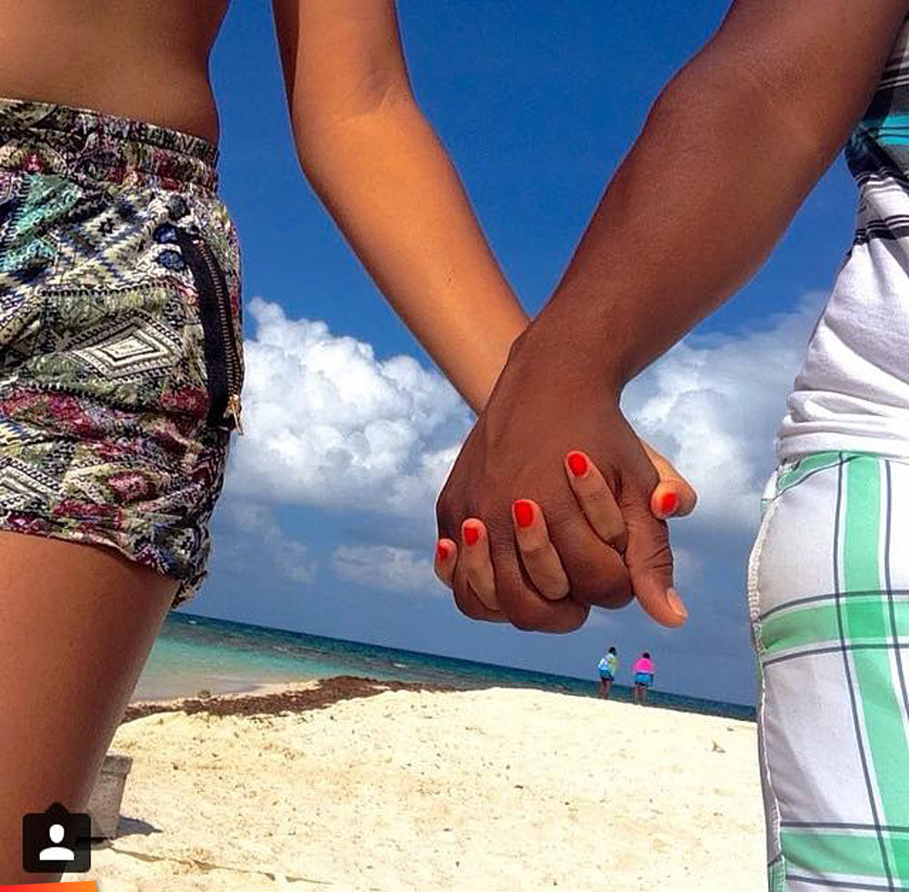 Hands together, a stroll on the beach
