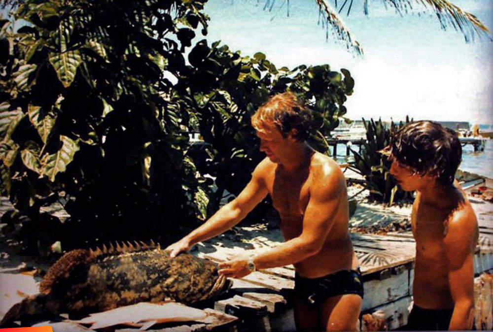 David Childs and Rogie preparing a grouper for BBQ, 1980's