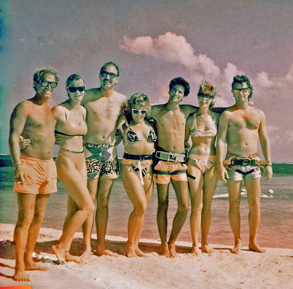 Seven friends hanging out on the beach, 1980's, includes  Sallie Martin and James Karo