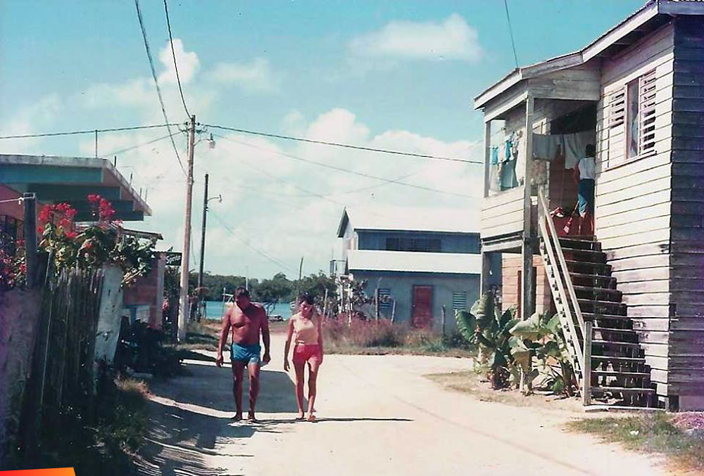Rodolfo Nunez and Gloria Nunez in front of Dulce Wolfe Fields' moms house, 1980's