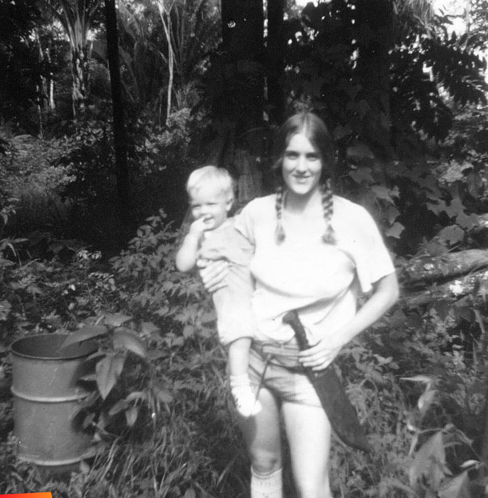Nancy R. Koerner with her son Julian Sherrard, mid-1970's, almost directly across the river from the property which would later become Chaa Creek