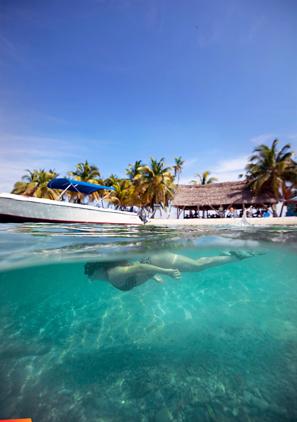 Snorkeling under a boat on Laughing Bird Caye