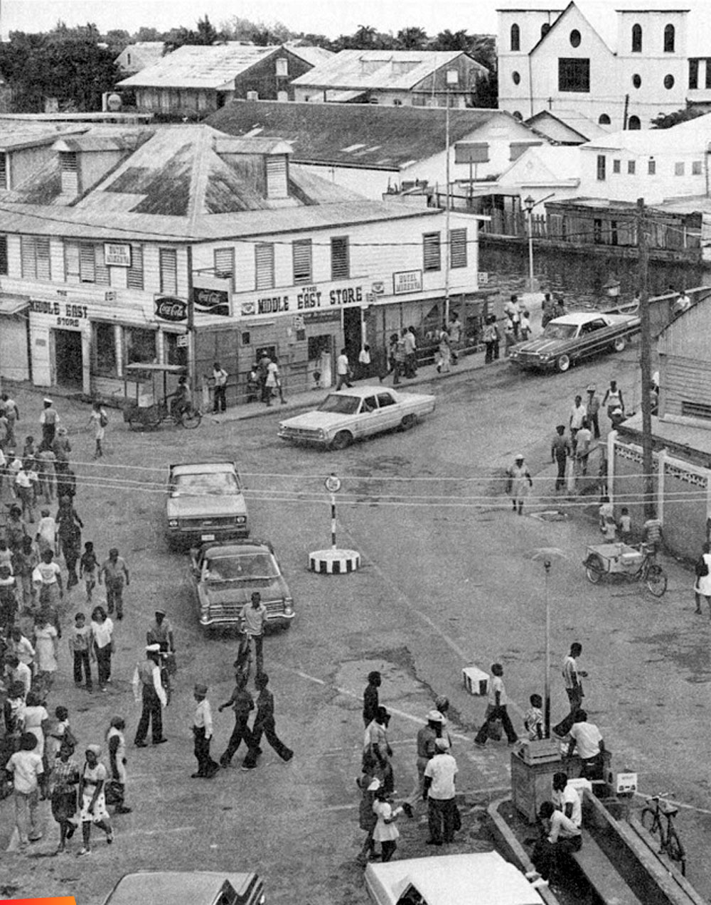 Intersection of Regent and Alberta streets at the south end of the swing bridge which separates the two major sections of Belize City, 1970's