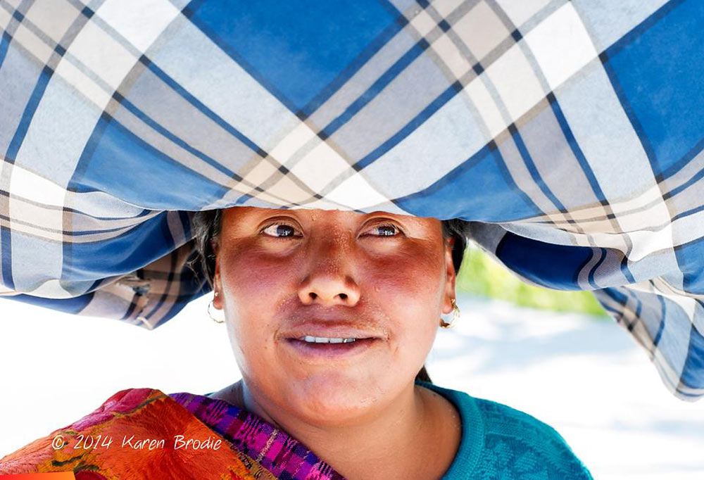 Guatemalan lady with big bundle on her head