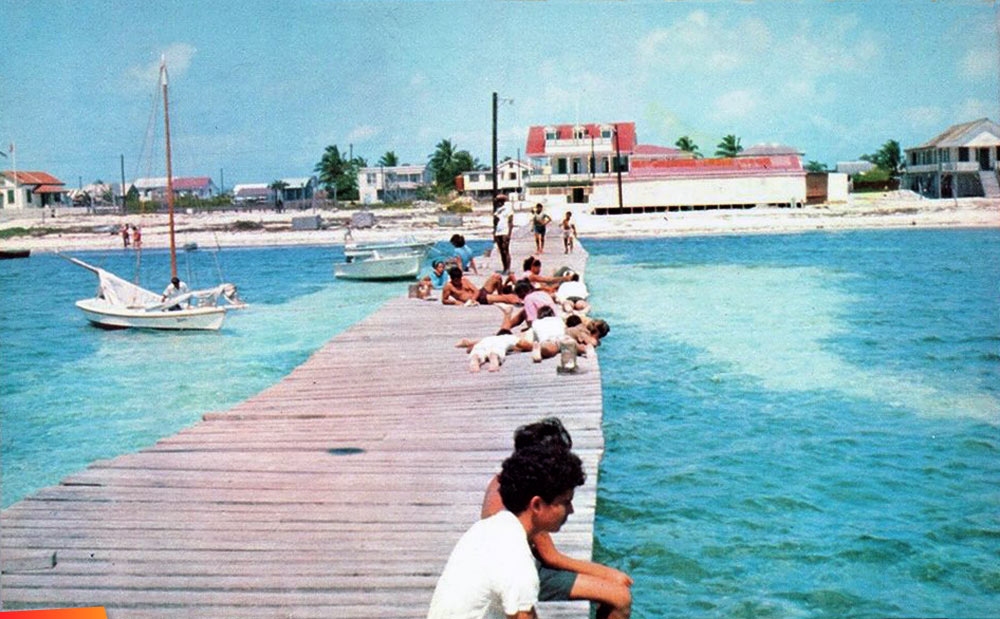 Folks on the pier in downtown San Pedro, looking towards town, long ago