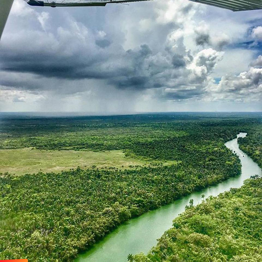 Flying over the Belize River, near the International Airport