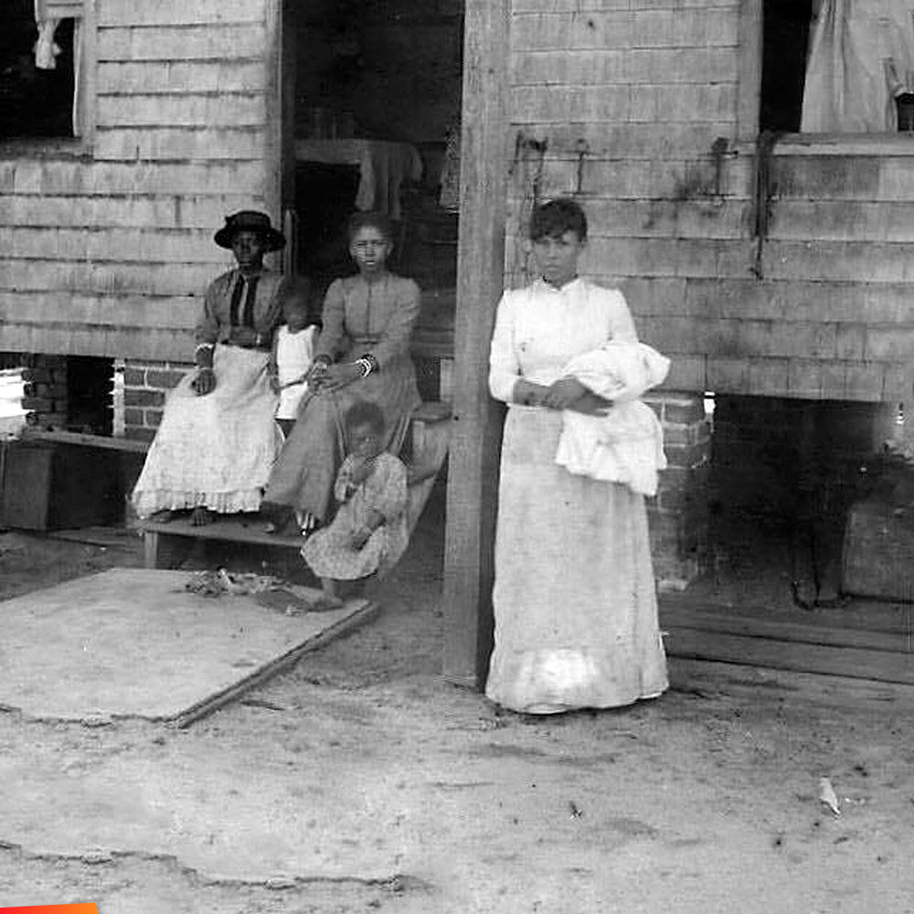 In 1891 Belize City women chilling in front of their house in British Honduras (Belize)