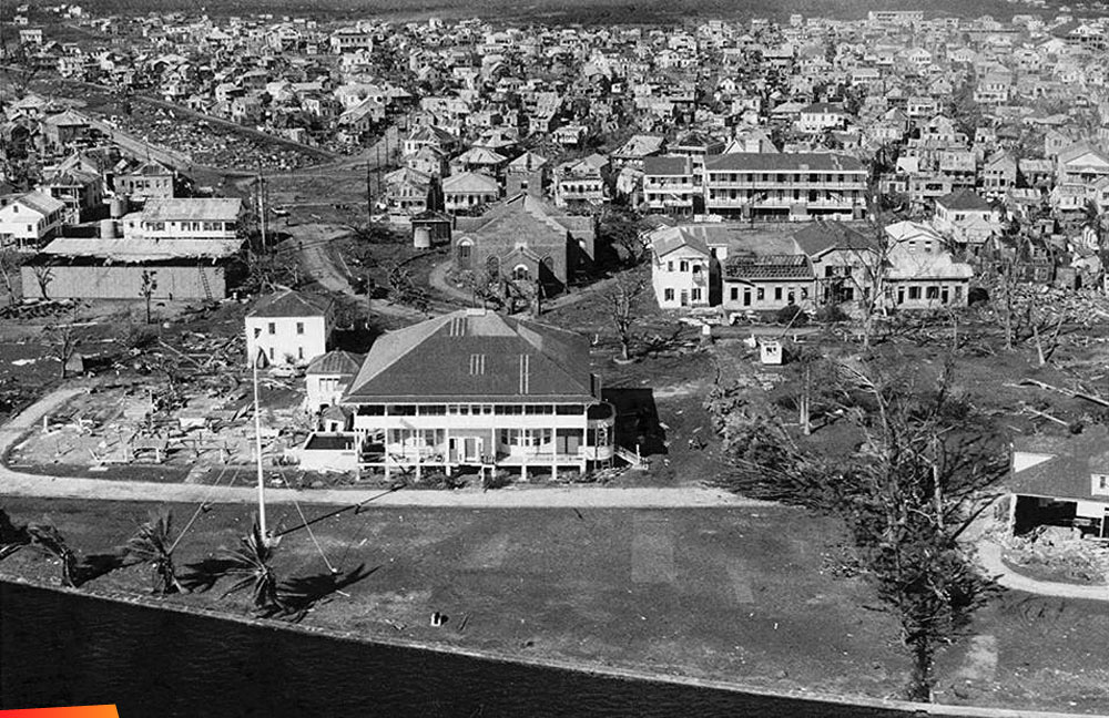 Government House after Hurricane Hattie (1961). Two views, one aerial
