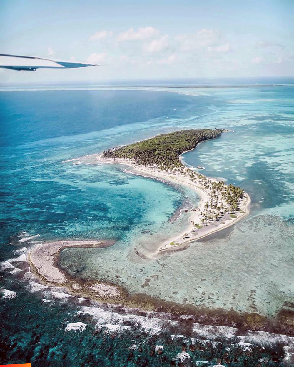 Over Halfmoon Caye while doing the aerial Blue Hole Tour with Tropic Air