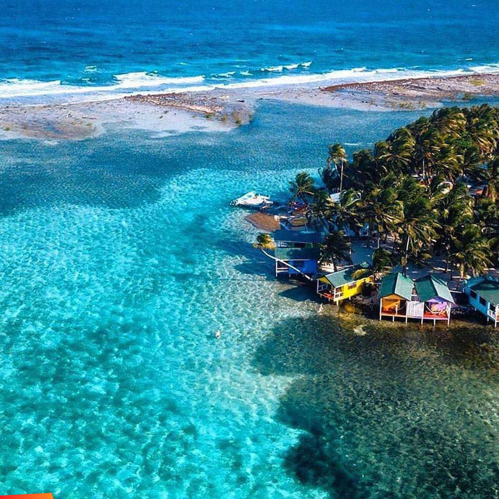 Aerial view of our beautiful Tobacco Caye and the reef