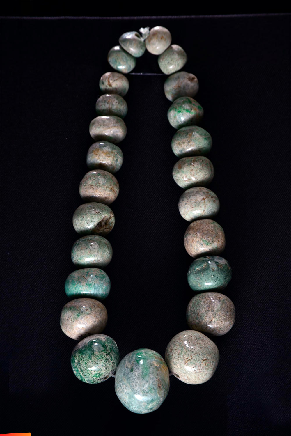 Jade necklace found in the tomb of the seventh ajau (ruler), nicknamed Ruler G, of Pusilha (Toledo District)