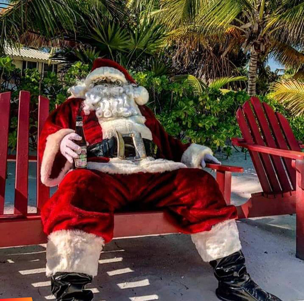 Santa got stuck in Belize, kicking back with a Belikin