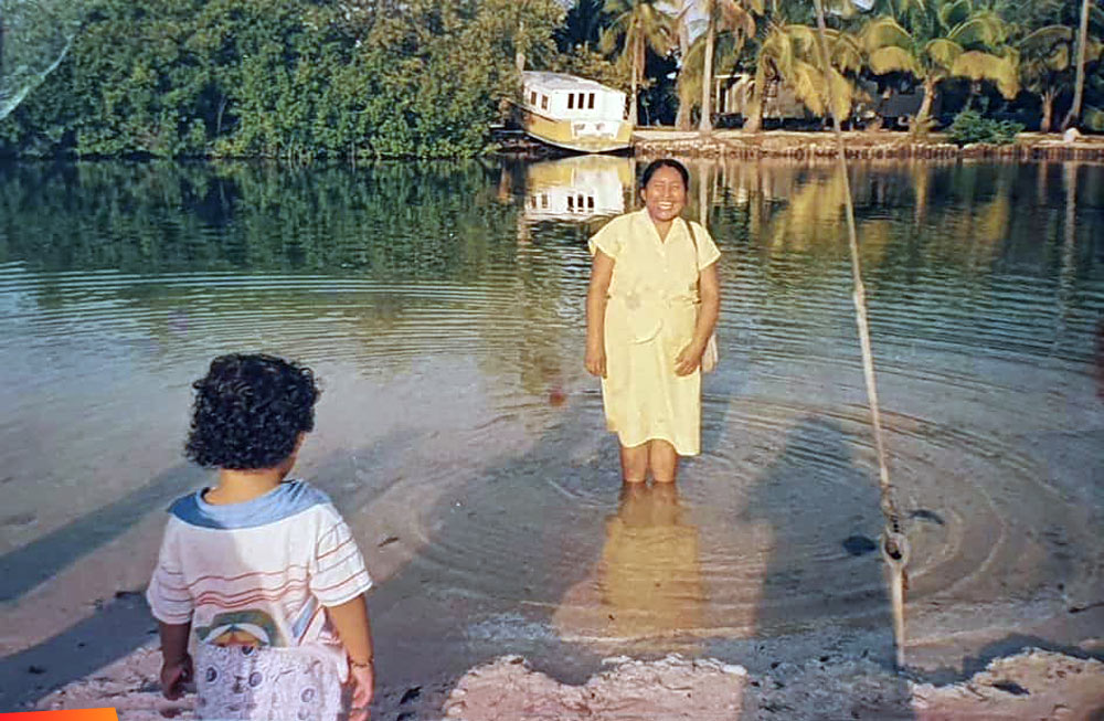 Henry Salgero with his grandmothers sister at Boca del Rio in San Pedro, with the Andrea water ferry in the background, about 1994