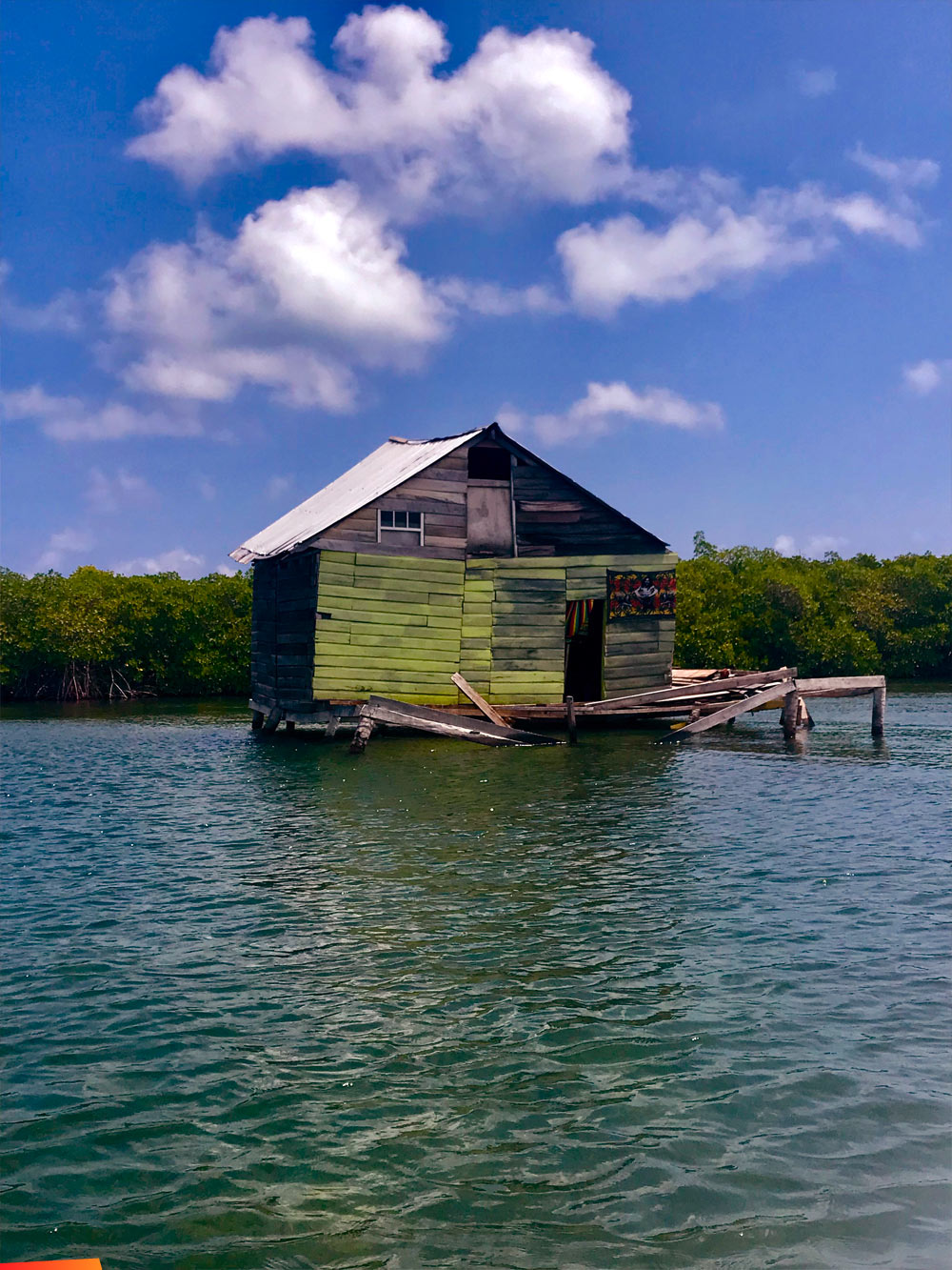 Chateau Relaxeau, small building with a pier in the mangroves