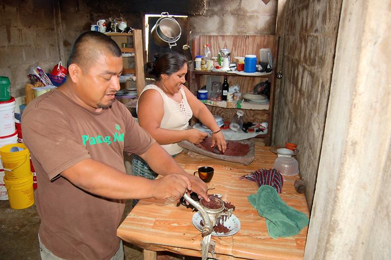 Juan Cho and his wife handmaking chocolate in San Felipe Village near Punta Gorda