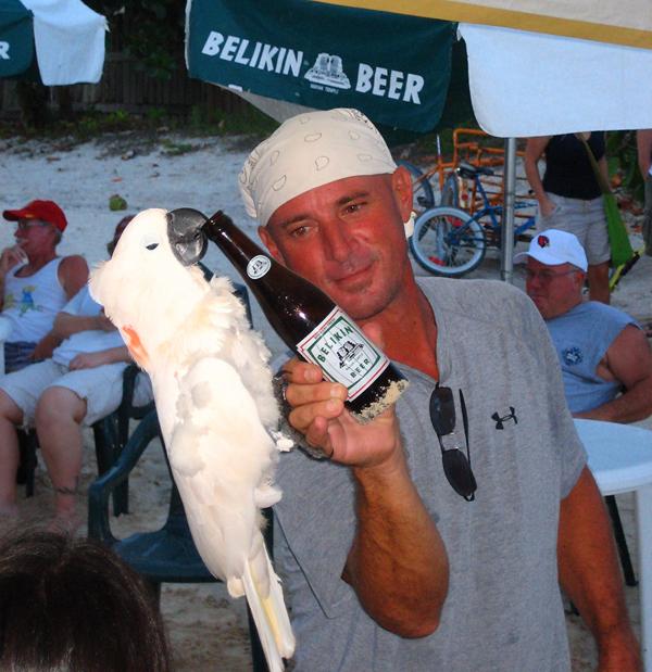 Robert with Gabriella doing the famous - Cockatoo hanging from a Belikin bottle - trick.