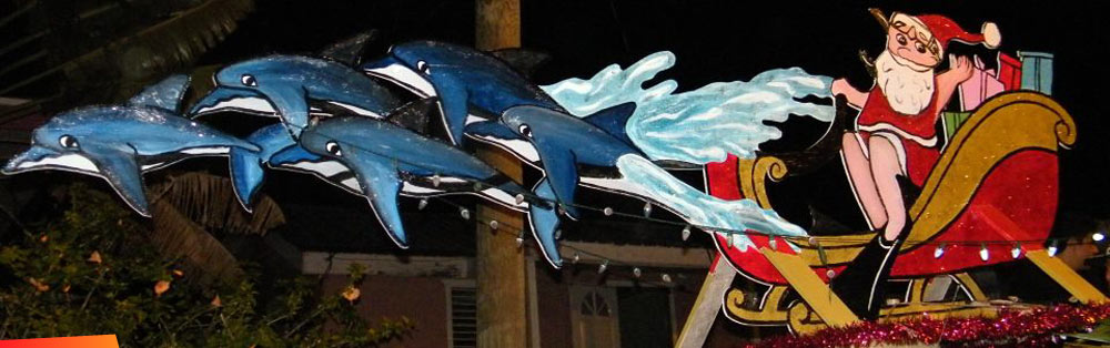 Santa and his sleigh being pulled by dolphins