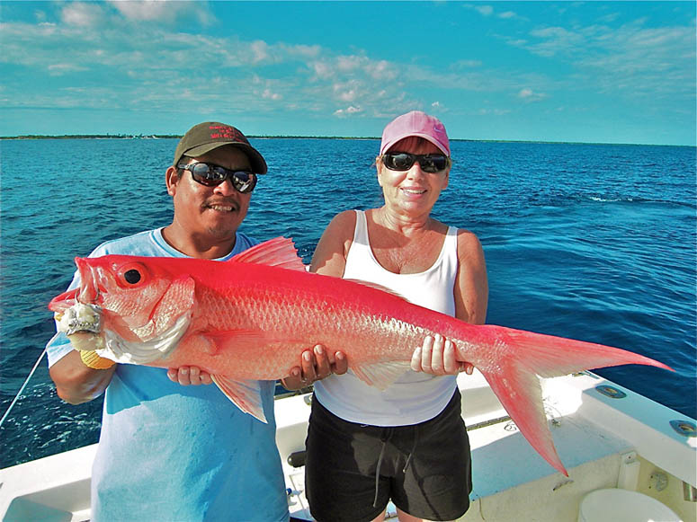 Rebecca Berlin and Jerry Ack with a large queen snapper