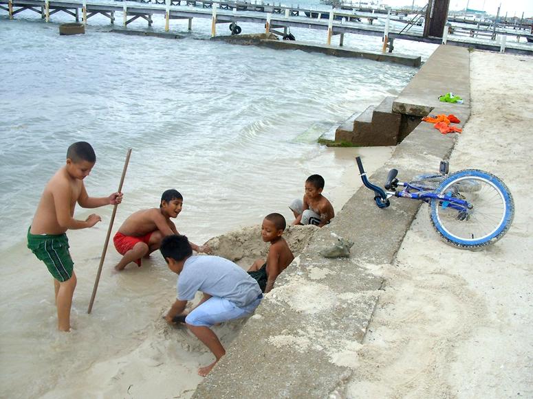 Boys playing along the shore, San Pedro