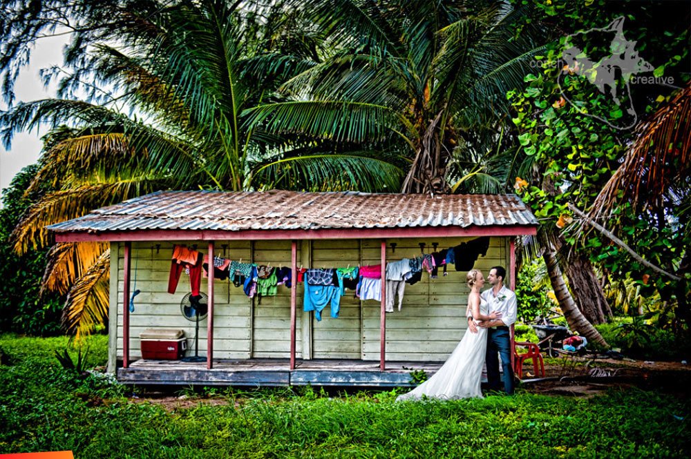 Love among the palm trees and laundry, wedding couple on St. George's Caye