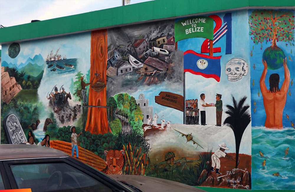 This mural in San Ignacio depicts Belizes history, colonial warts and all.