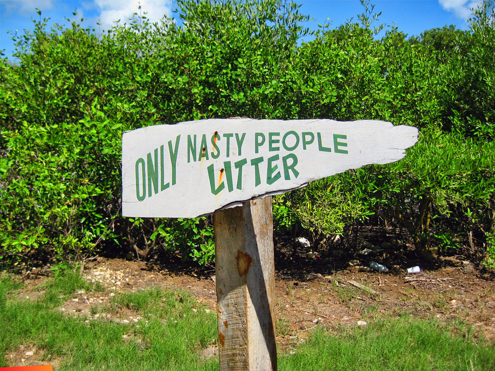 A roadside sign at Birds Isle, Only Nasty People Litter