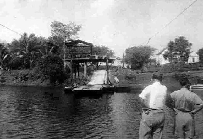 The hand-cranked ferry across the river at Burrell Boom, 1940's and 1959