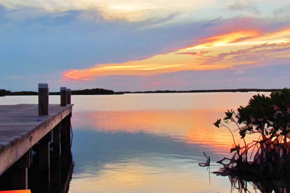 Sunset from the lagoon side dock near White Sands Cove on Ambergris Caye
