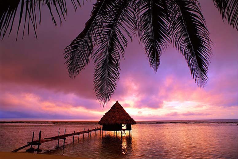 Cabana over the water at sunrise