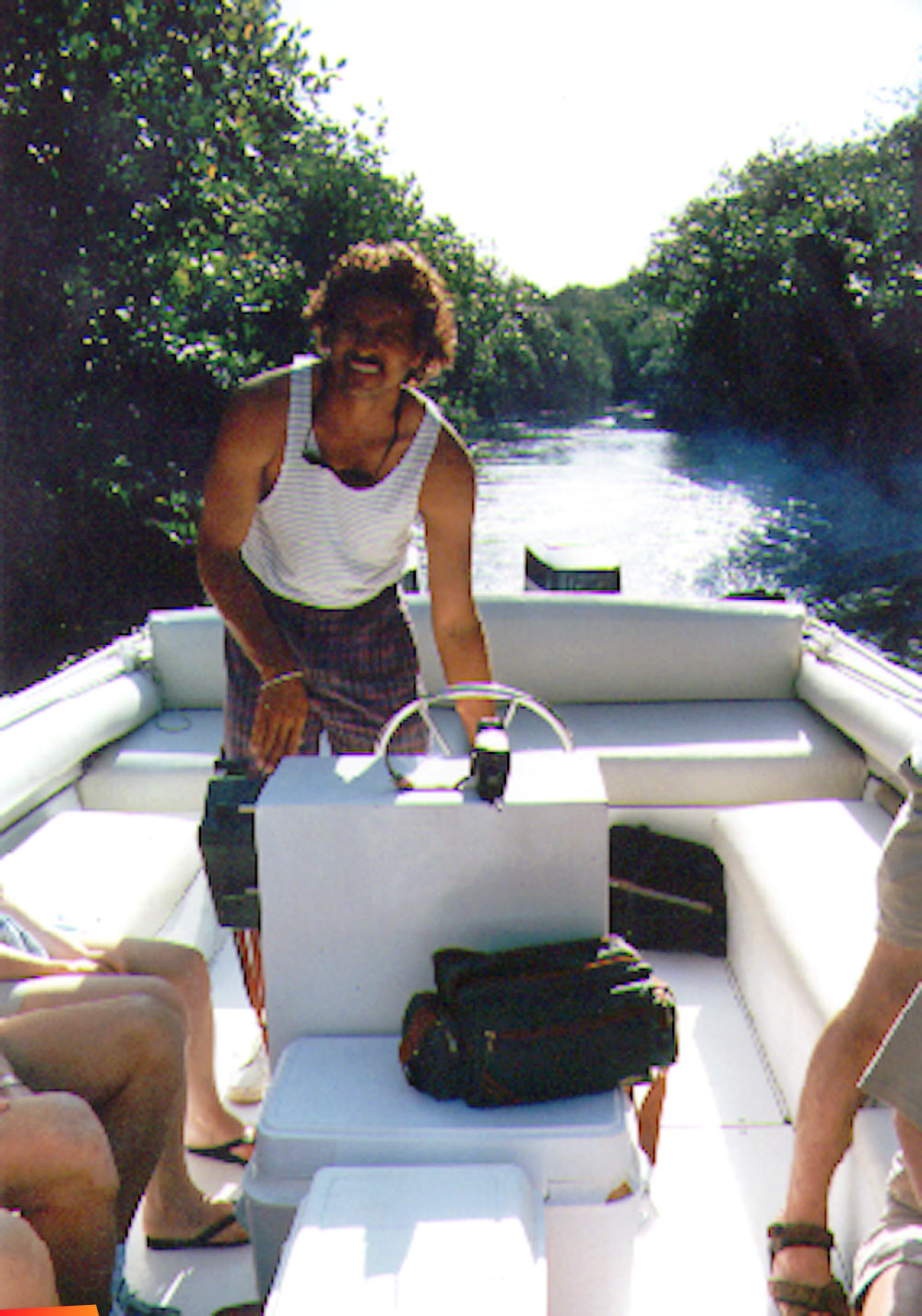 Daniel Nunez of Tanisha Tours driving the boat through the mangroves on the way back from Lamanai, 1997
