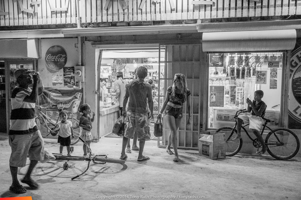 Caye Caulker: Evening transactions take place at the local mom and pop store...
