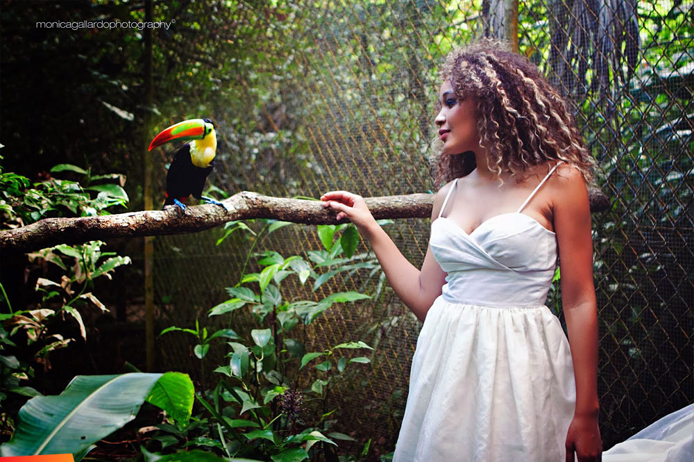 Destinee Arnold / Miss Belize with a toucan