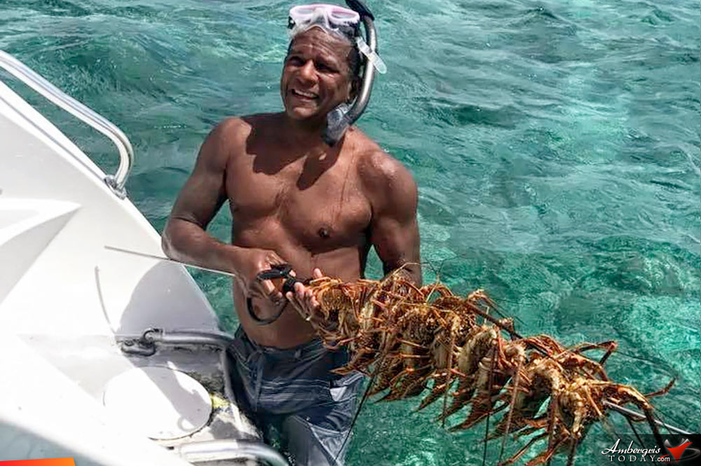Fresh lunch on board Seaduced by Belize as captain Elito Arceo shows of his lobster catch of the day to his guests