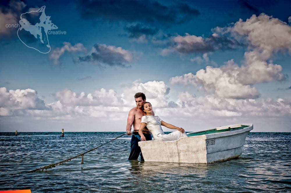 Bride and groom relaxing in a small boat