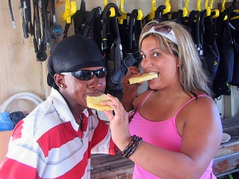 Trav & Stephania snacking on fresh pineapple
