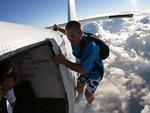 Hanging onto the outside of a plane, skydiving